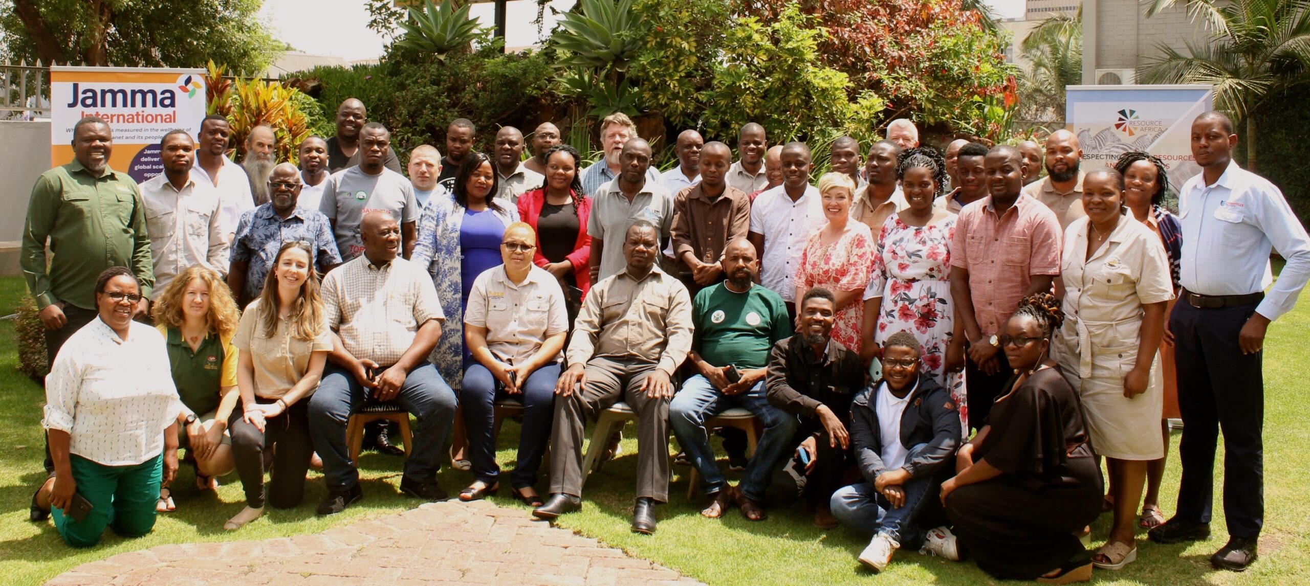 A large group of conference attendees posing for a photo.